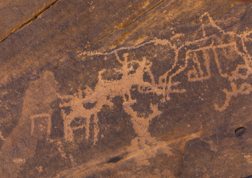 Petroglyphs on a rock depicting hunters, Najran Province, Najd Khayran, Saudi Arabia