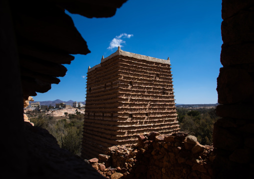 Red stone and mud house with slates in a village, Asir province, Sarat Abidah, Saudi Arabia