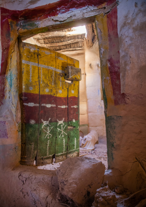 Old colorful wooden door of an abandonned house, Asir province, Sarat Abidah, Saudi Arabia