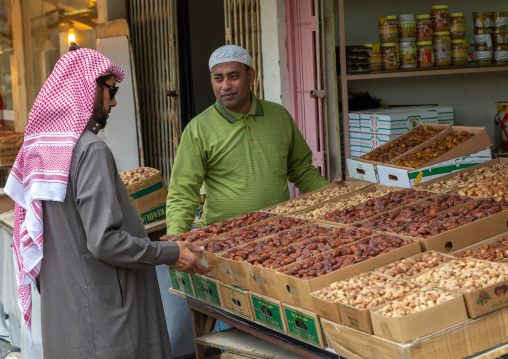 Saudi man buying dates in a market, Al-Bahah region, Al-Bahah, Saudi Arabia