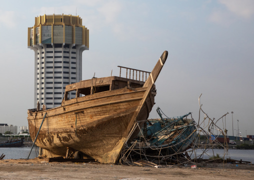 Old fishermen boats in front of the islamic port tower, Mecca province, Jeddah, Saudi Arabia