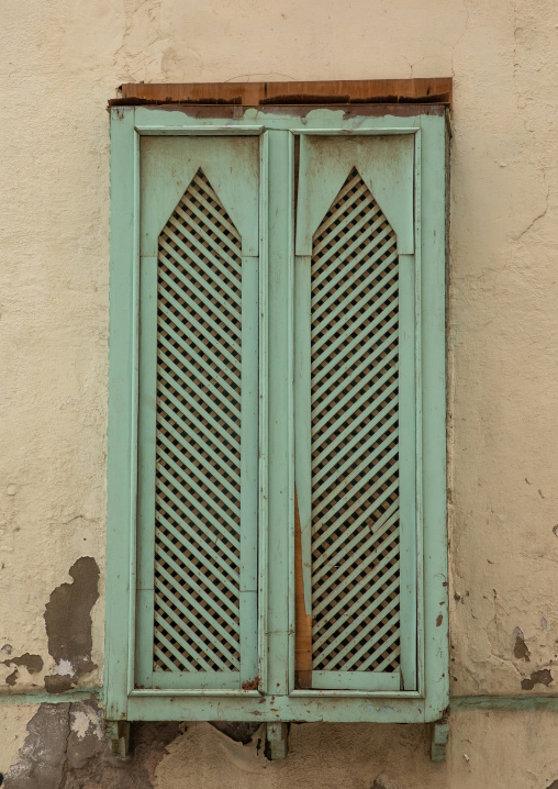 Green window of an old house used as a free dormitory in the past, Mecca province, Jeddah, Saudi Arabia