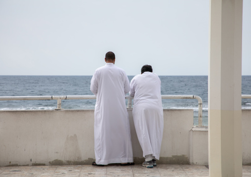 Saudi men looking at the sea, Mecca province, Jeddah, Saudi Arabia