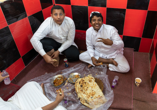 Saudi friends eating in a local restaurant, Red Sea, Farasan, Saudi Arabia