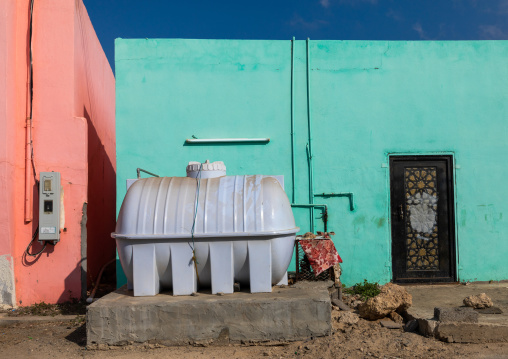 Water tank in the street in front of a house, Red Sea, Farasan, Saudi Arabia