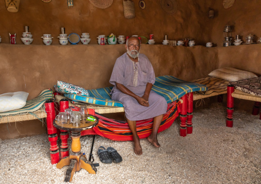 Saudi man sit insidea traditional house, Red Sea, Farasan, Saudi Arabia