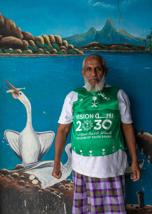 Portrait of a farasani man wearing a shirt with 2030 logo, Red Sea, Farasan, Saudi Arabia