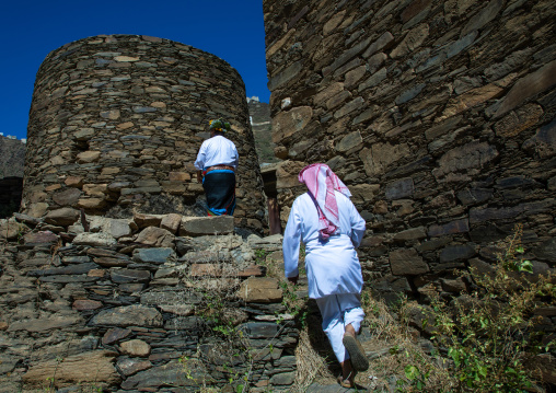 Saudi men entering a village with stone houses, Jizan Province, Addayer, Saudi Arabia