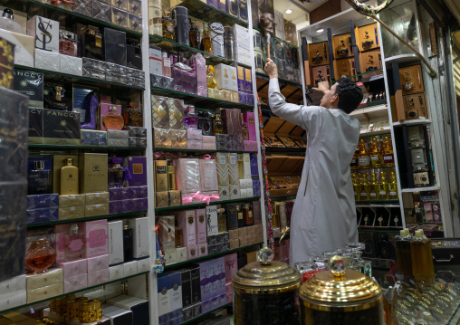 Saudi man cleaning his perfume shop, Jizan Province, Sabya, Saudi Arabia