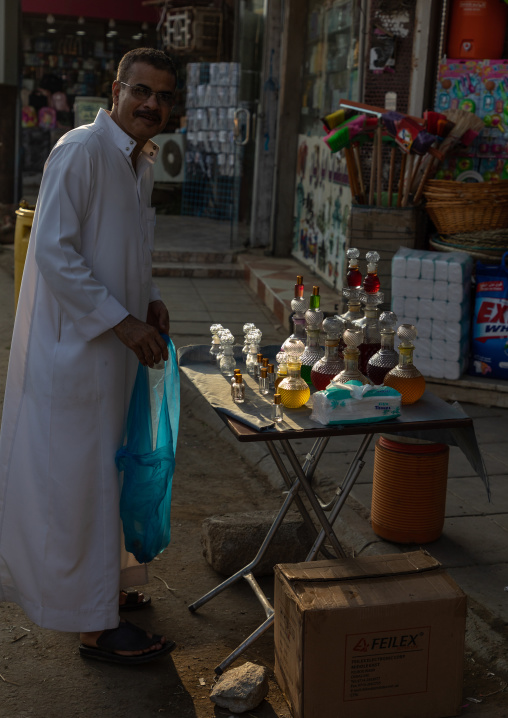 Saudi man buying some perfume in a market, Jizan Province, Sabya, Saudi Arabia