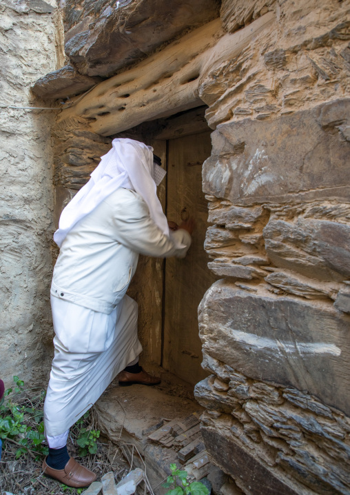 Saudi man entering an old house, Jizan Province, Addayer, Saudi Arabia