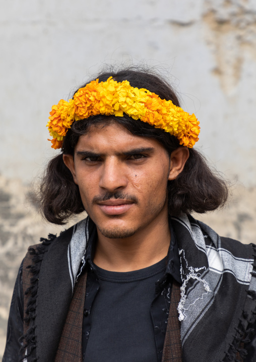 Portrait of a flower man wearing a yellow floral crown on the head, Jizan Province, Addayer, Saudi Arabia