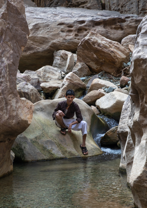 Saudi young man in wadi lajab, Jizan Province, Jebel Qahar, Saudi Arabia