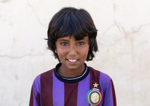 Portrait of a saudi boy wearing a football shirt, Najran Province, Najran, Saudi Arabia