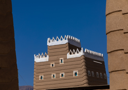 Traditional old mud house against blue sky, Najran Province, Najran, Saudi Arabia