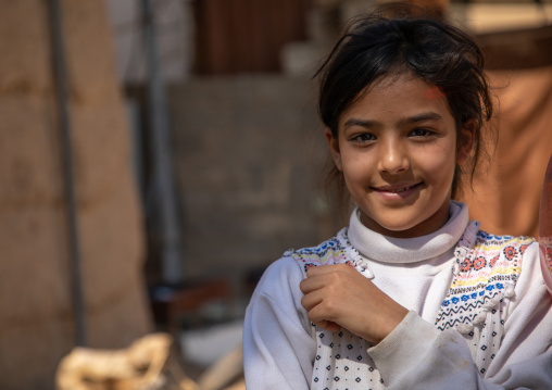 Portrait of a shy saudi girl in the street, Najran Province, Najran, Saudi Arabia
