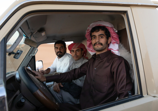 Saudi men in their toyota car, Rub al-Khali, Khubash, Saudi Arabia