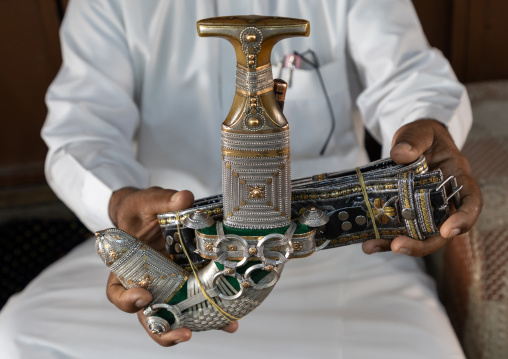 Saudi man holding a janbiya dagger, Najran Province, Najran, Saudi Arabia