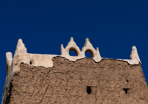 Traditional old mud house against blue sky, Asir province, Dhahran Al Janub, Saudi Arabia