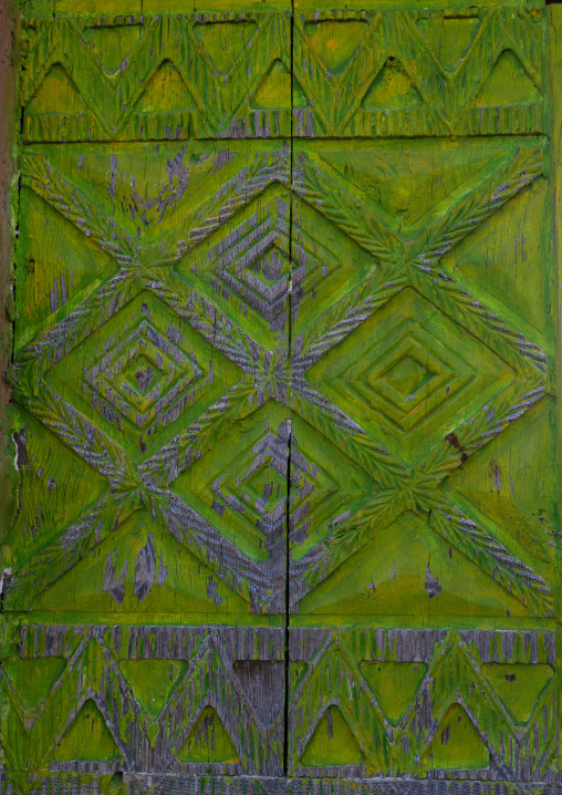 Green wooden door of an old asiri house, Asir province, Khamis Mushait, Saudi Arabia