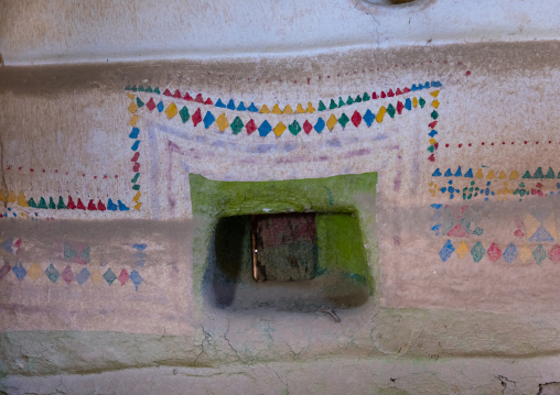 Al-qatt al-asiri traditionally female interior window decoration in an abandonned house, Asir province, Sarat Abidah, Saudi Arabia