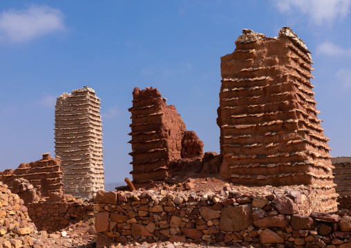 Red stone and mud houses and watchtower with slates in a village, Asir province, Sarat Abidah, Saudi Arabia