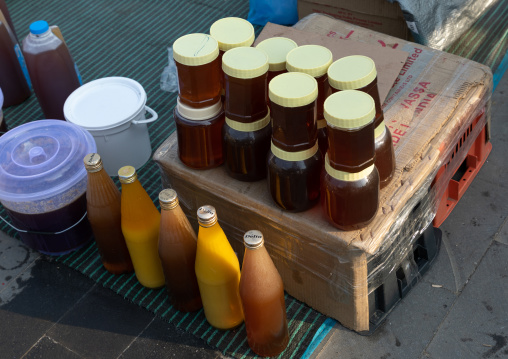 Honey for sale on a market, Asir province, Muhayil, Saudi Arabia