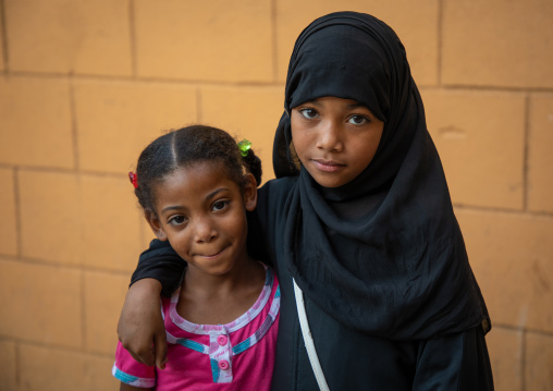 Portrait of two yemeni refugee girls, Asir province, Muhayil, Saudi Arabia