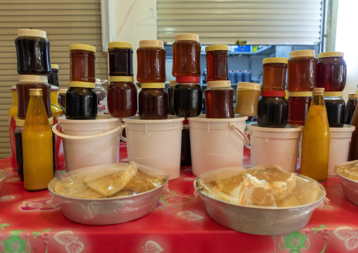 Honey and honeycombs for sale on a market, Asir province, Muhayil, Saudi Arabia