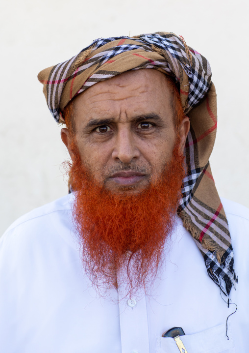 Portrait of a saudi man with a red beard and a burberry style keffieh, Jizan Province, Addayer, Saudi Arabia