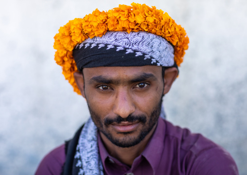 Portrait of a yemeni refugee wearing a floral crown on the head, Jizan Province, Addayer, Saudi Arabia