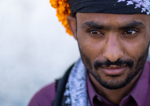 Portrait of a yemeni refugee wearing a floral crown on the head, Jizan Province, Addayer, Saudi Arabia