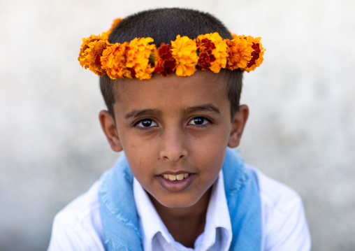 Portrait of a flower boy wearing a floral crown on the head, Jizan Province, Addayer, Saudi Arabia