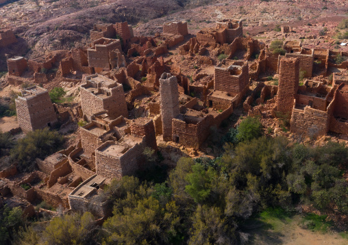 Aerial view of red stone and mud houses with slates in a village, Asir province, Sarat Abidah, Saudi Arabia
