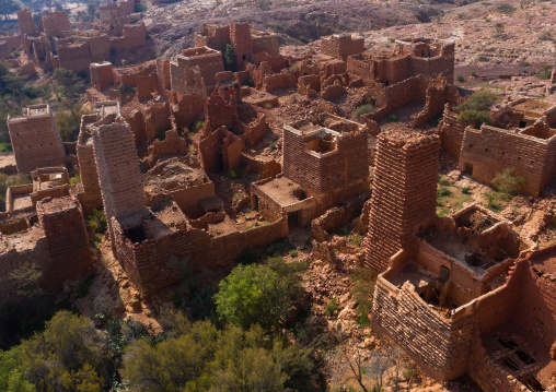 Aerial view of red stone and mud houses with slates in a village, Asir province, Sarat Abidah, Saudi Arabia