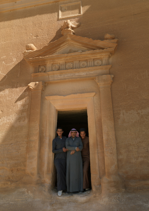Saudi tourists in front of a Nabataean tomb in al-Hijr archaeological site in Madain Saleh, Al Madinah Province, Alula, Saudi Arabia