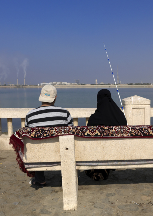 Couple in the corniche fishing, Mecca province, Jeddah, Saudi Arabia