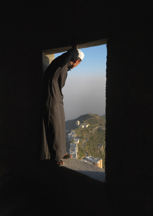 Saudi man looking over his window, Fifa Mountains, Al-Sarawat, Saudi Arabia