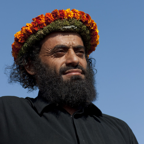 Portrait of a flower man wearing a floral crown on the head, Jizan province, Addayer, Saudi Arabia
