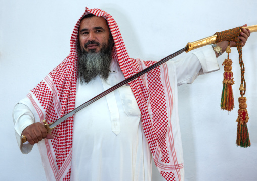 Portrait of an old saudi man with a sword, Al-Jawf Province, Sakaka, Saudi Arabia