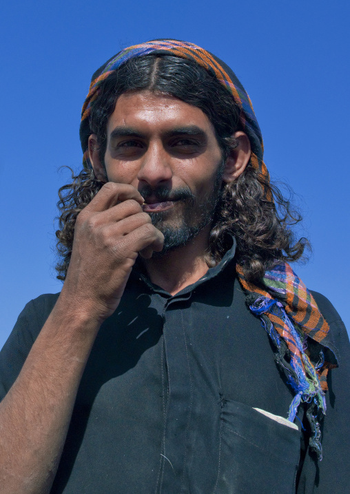 Portrait of a saudi man with long hair, Jizan province, Addayer, Saudi Arabia
