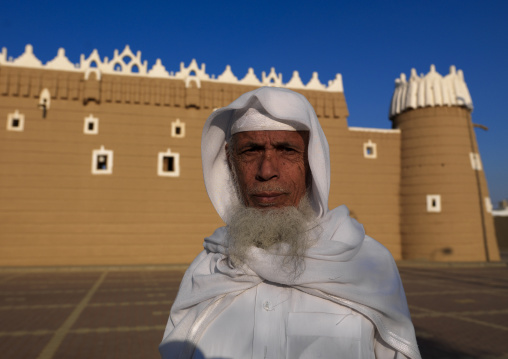 Old saudi man in front of the old fort, Najran Province, Najran, Saudi Arabia