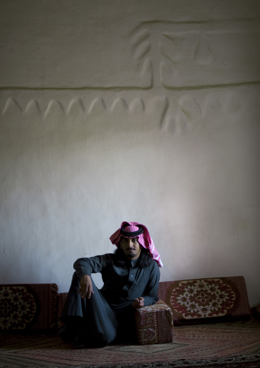 Portrait of a saudi man wearing a keffieh inside a traditional house, Najran Province, Najran, Saudi Arabia