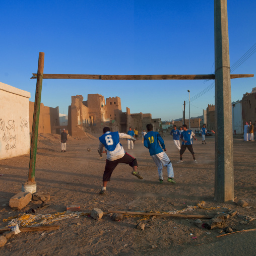 People playing football in the old town, Najran Province, Najran, Saudi Arabia