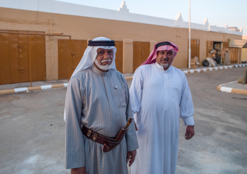 Saudi men in traditional clothing in the street, Asir province, Abha, Saudi Arabia