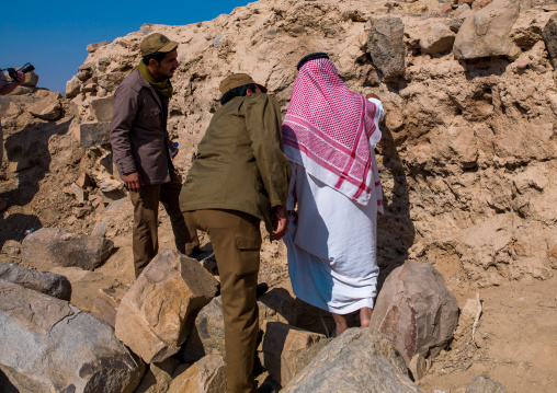 Saudi men searching old bones on al ukhdud site, Najran Province, Najran, Saudi Arabia