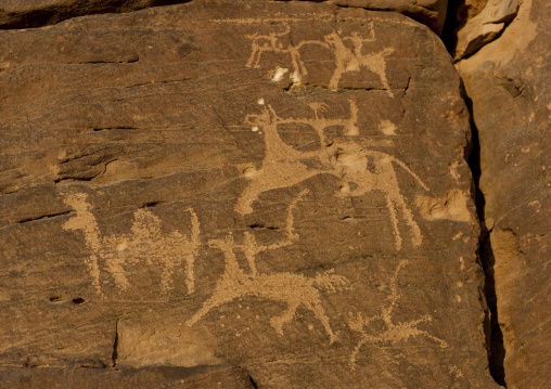 Petroglyphs rock art depicting hunters, Najran Province, Abar Himma, Saudi Arabia