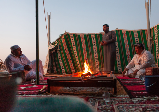 Bedouin making fire in a tent in the desert, Najran Province, Najran, Saudi Arabia