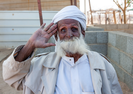 Saudi man eating his beard to make a joke, Najran Province, Najran, Saudi Arabia