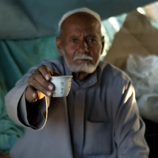 Saudi man offering a coffee, Najran Province, Najran, Saudi Arabia